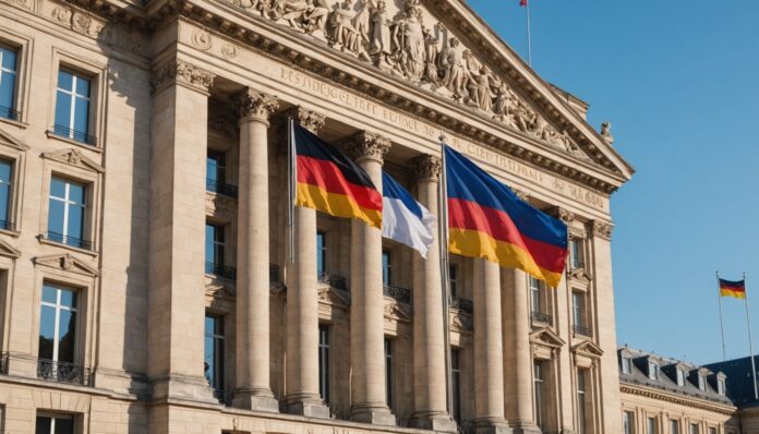 Visite d'État franco-allemande : drapeaux de la France et de l'Allemagne Drapeaux français et allemand flottant devant un bâtiment officiel, symbole de la visite d'État franco-allemande